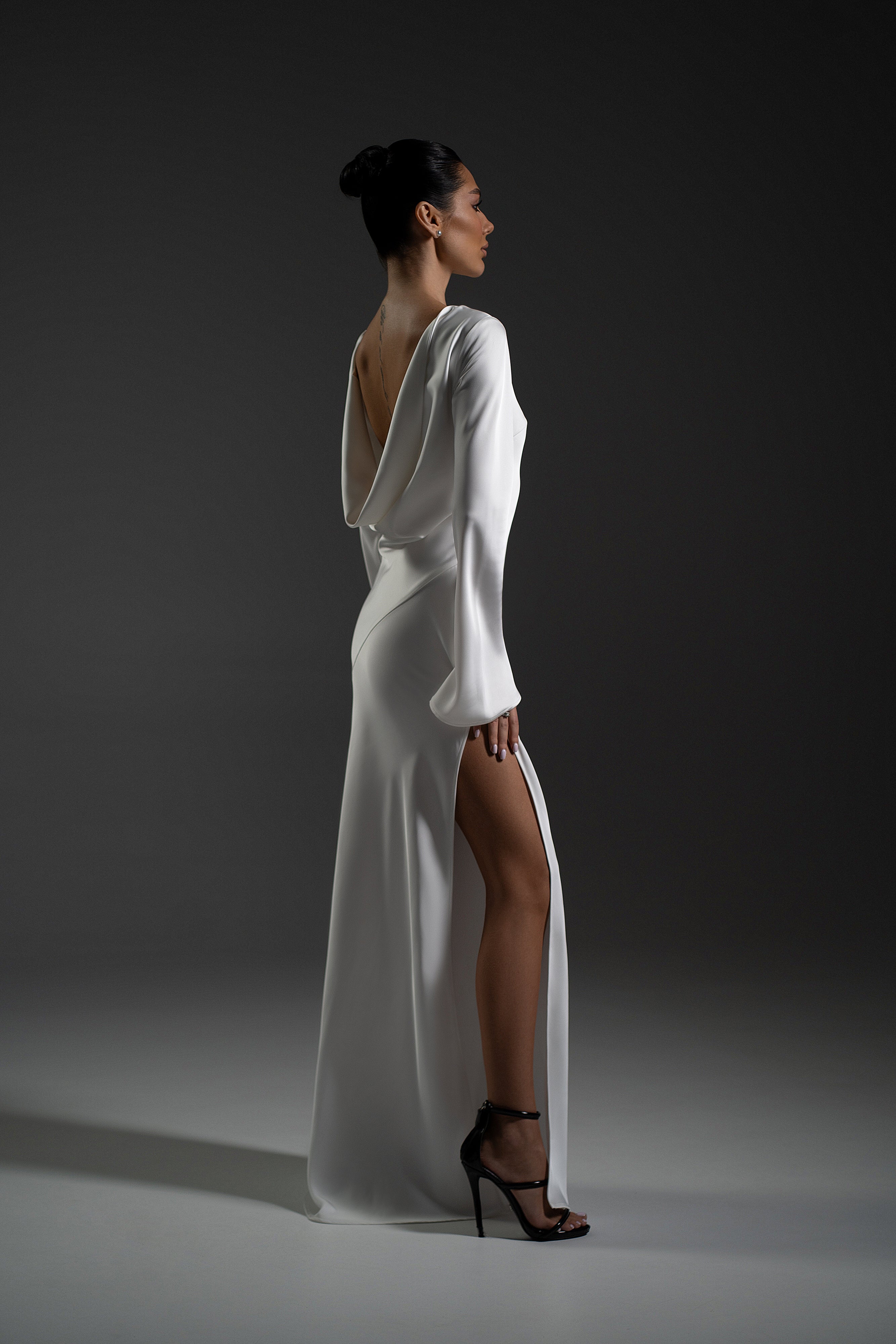 Naomi Dress in white color with open back and elegant evening silhouette
