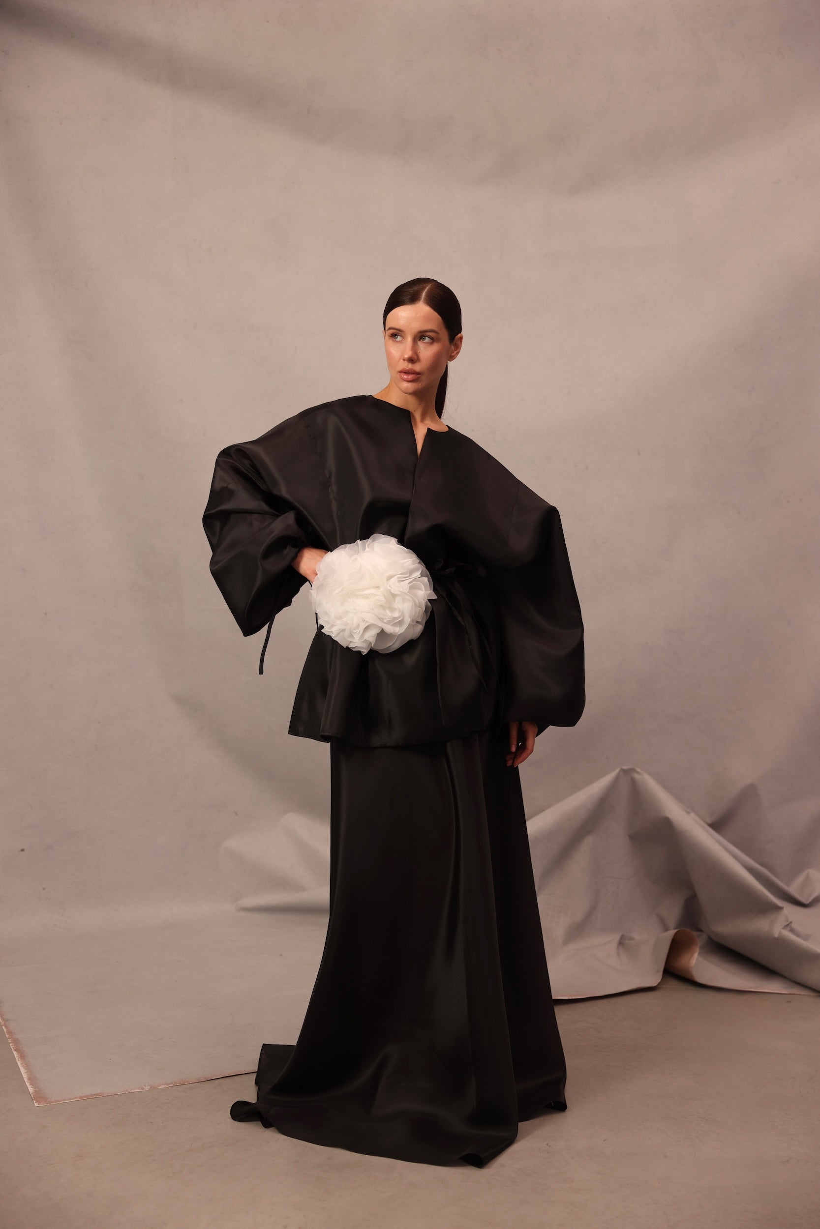 Back view of Set Comte in black color with flowing sheer trousers