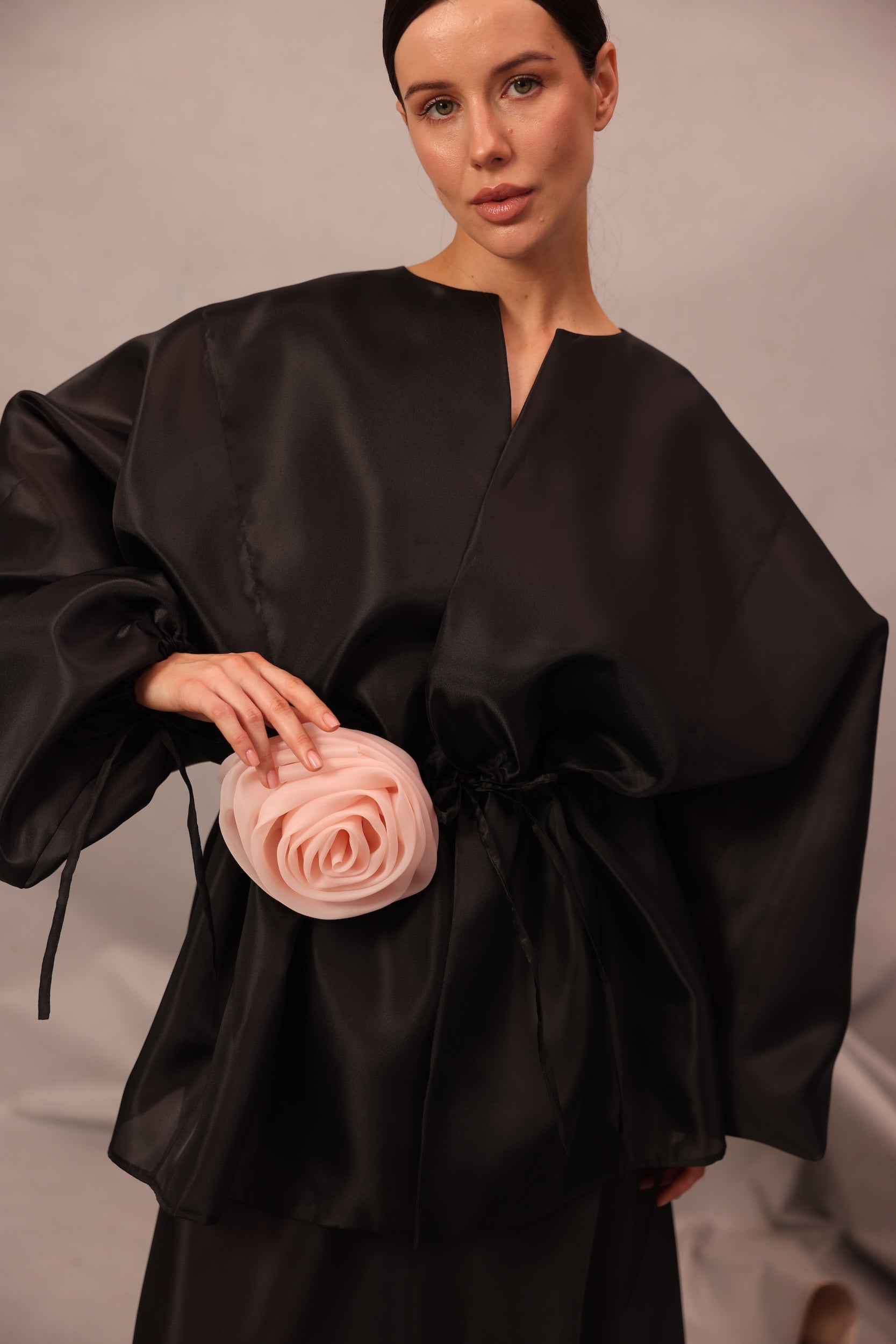 Close-up of Set Comte with delicate flower detail at the waist