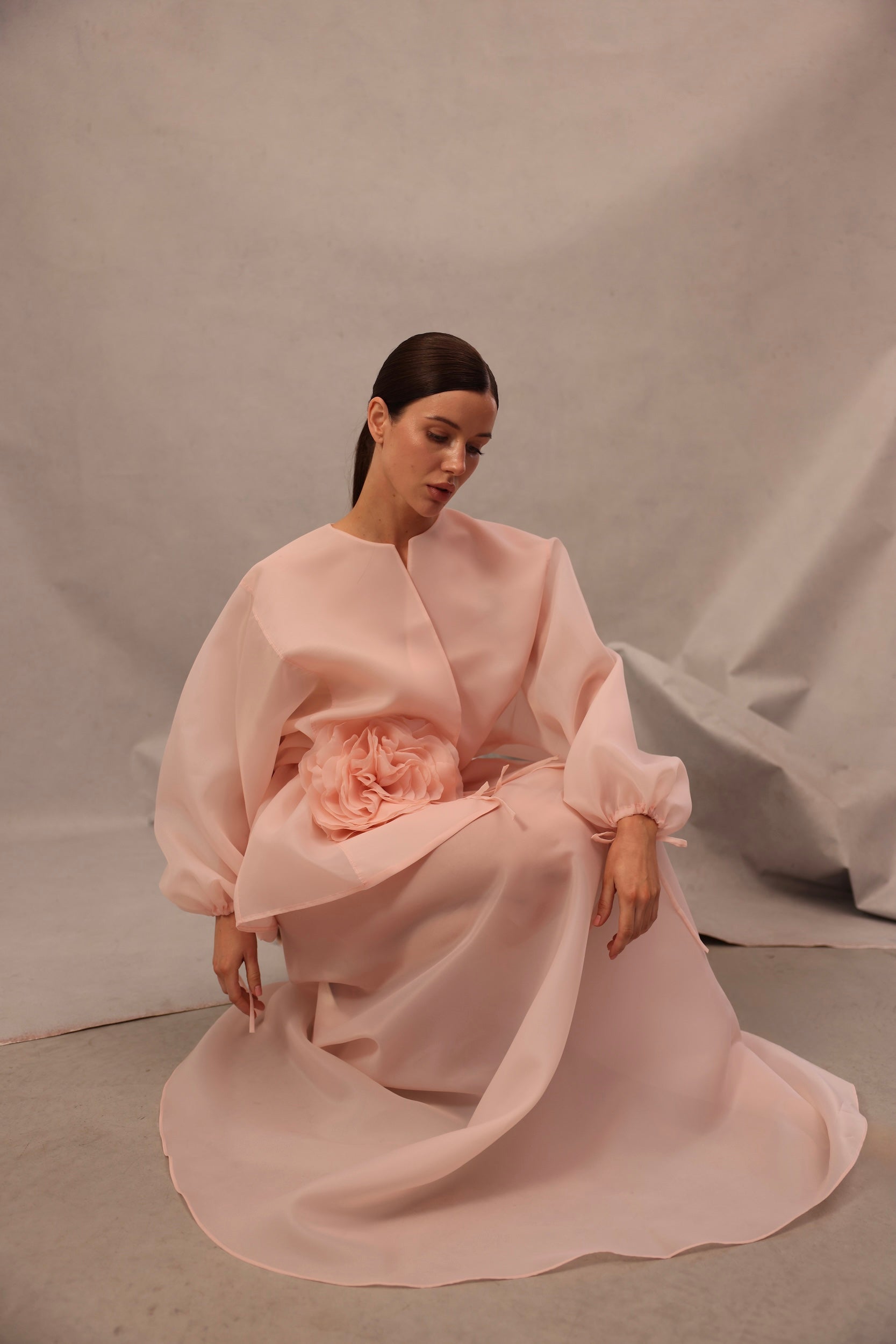 Seated view of Set Comte in pink-peach color by Lafatale Atelier