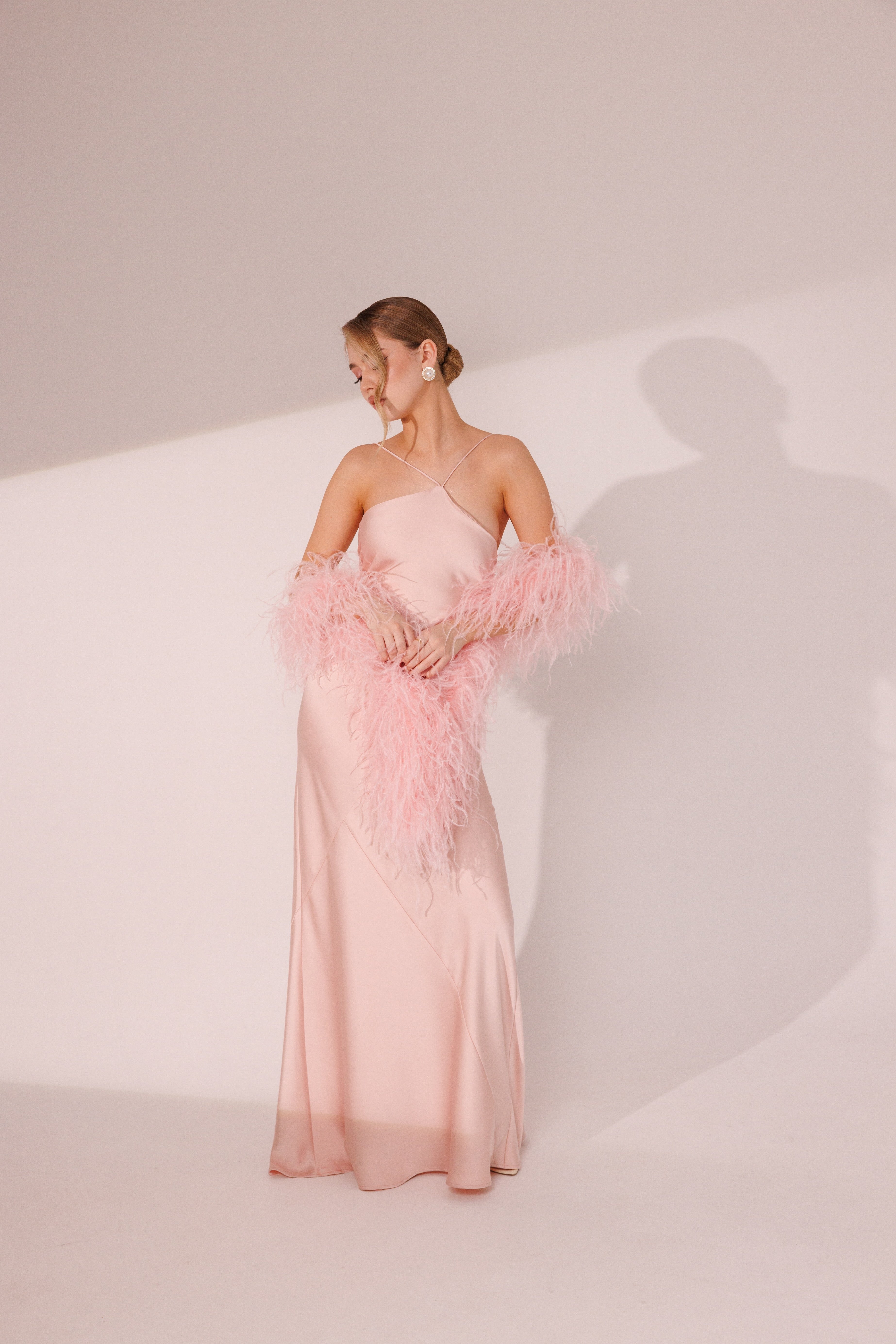 Model wearing Elara Dress in pink color for evening occasions