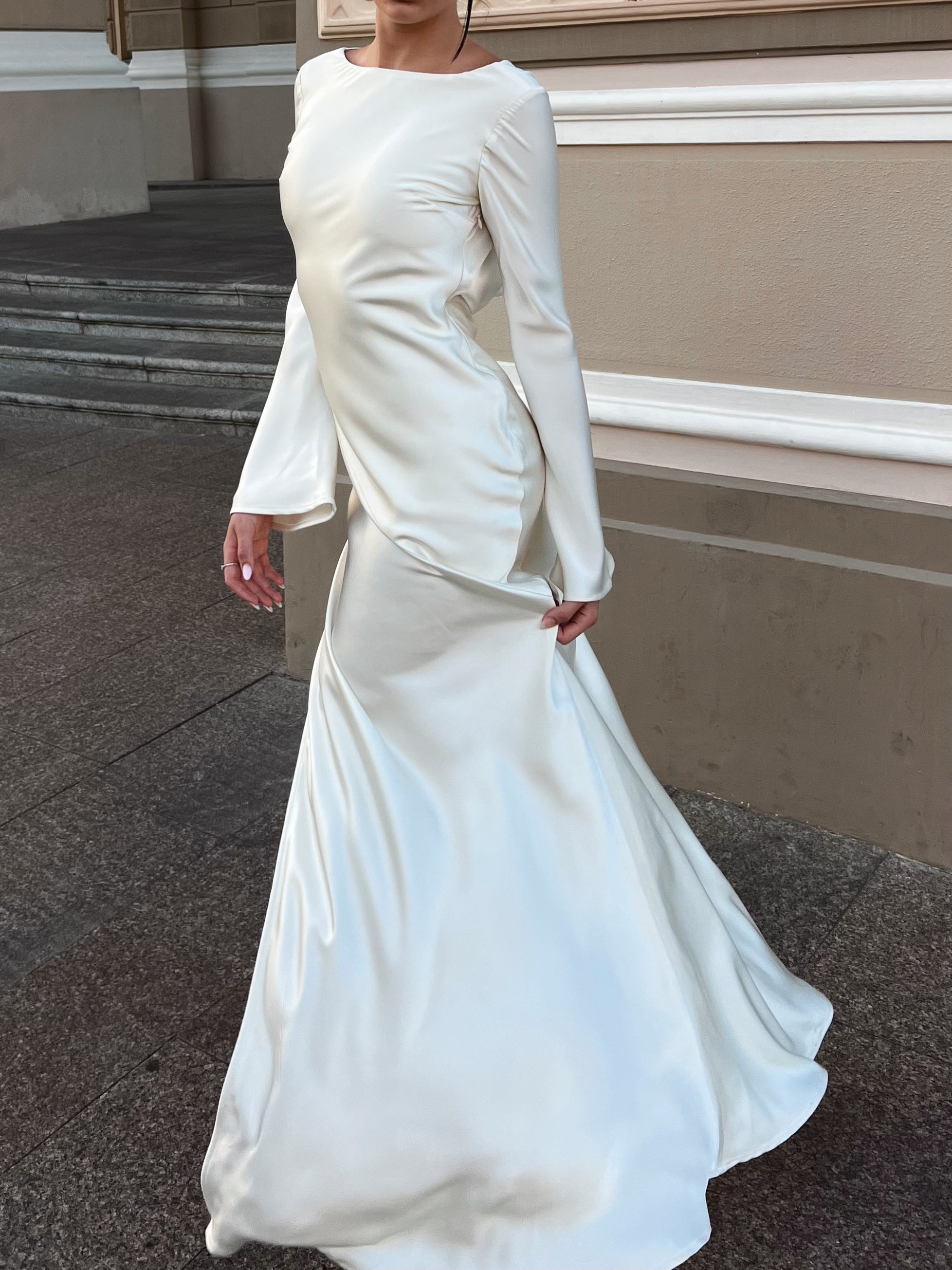 Side view of Naomi Dress in ivory color with flowing skirt