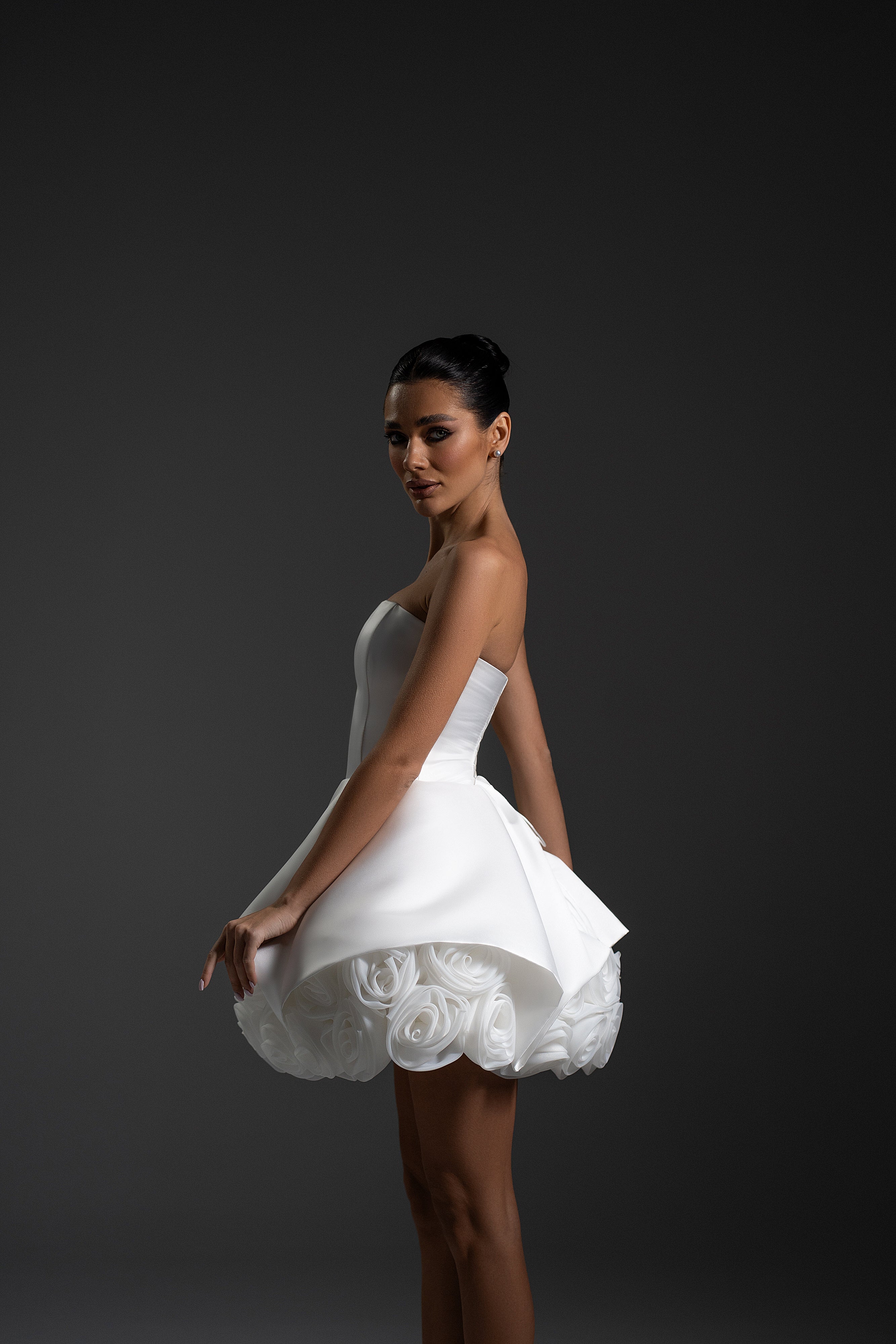 Side view of La Rose white couture mini dress