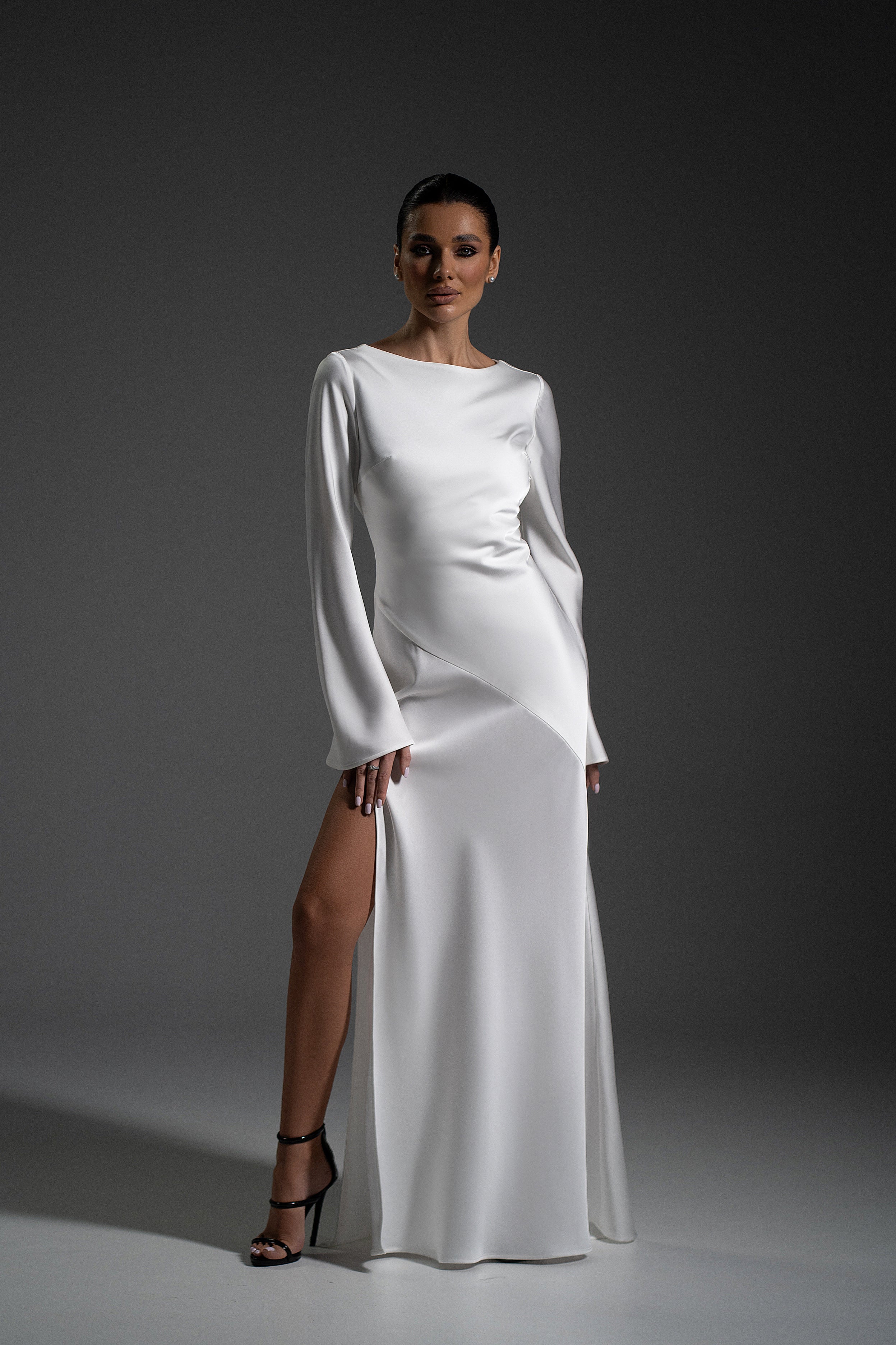 Front view of Naomi white maxi dress with high slit by Lafatale Atelier