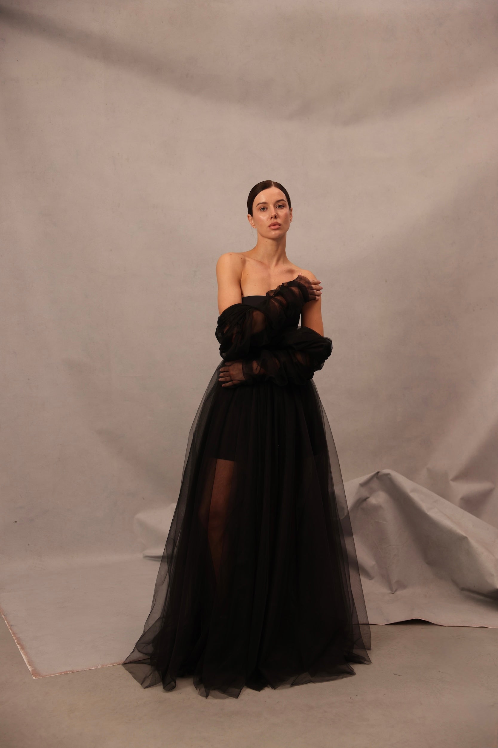 Model wearing Voile Sateen Dress in black color with sheer tulle skirt
