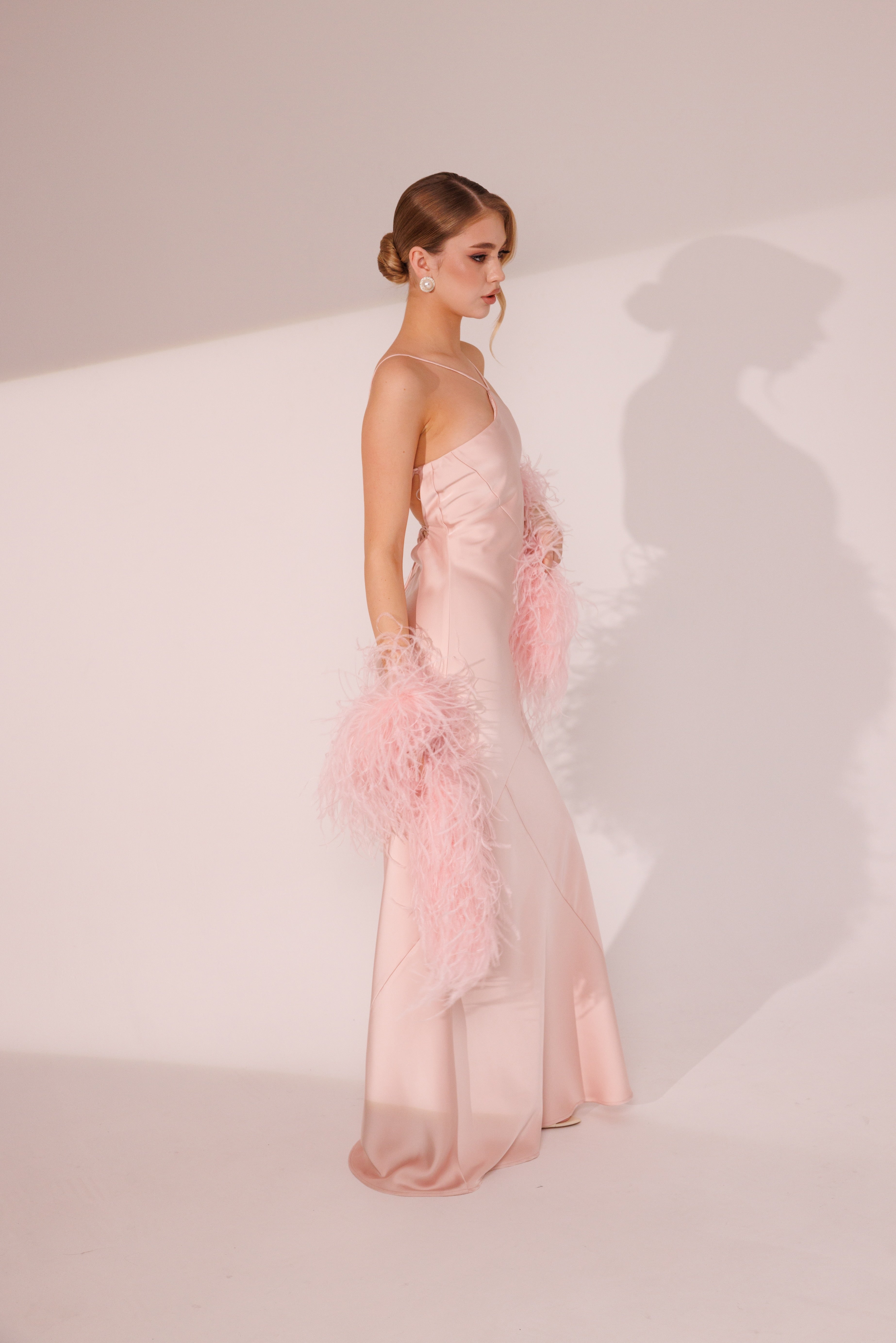 Side view of Elara Dress in pink color with fitted silhouette