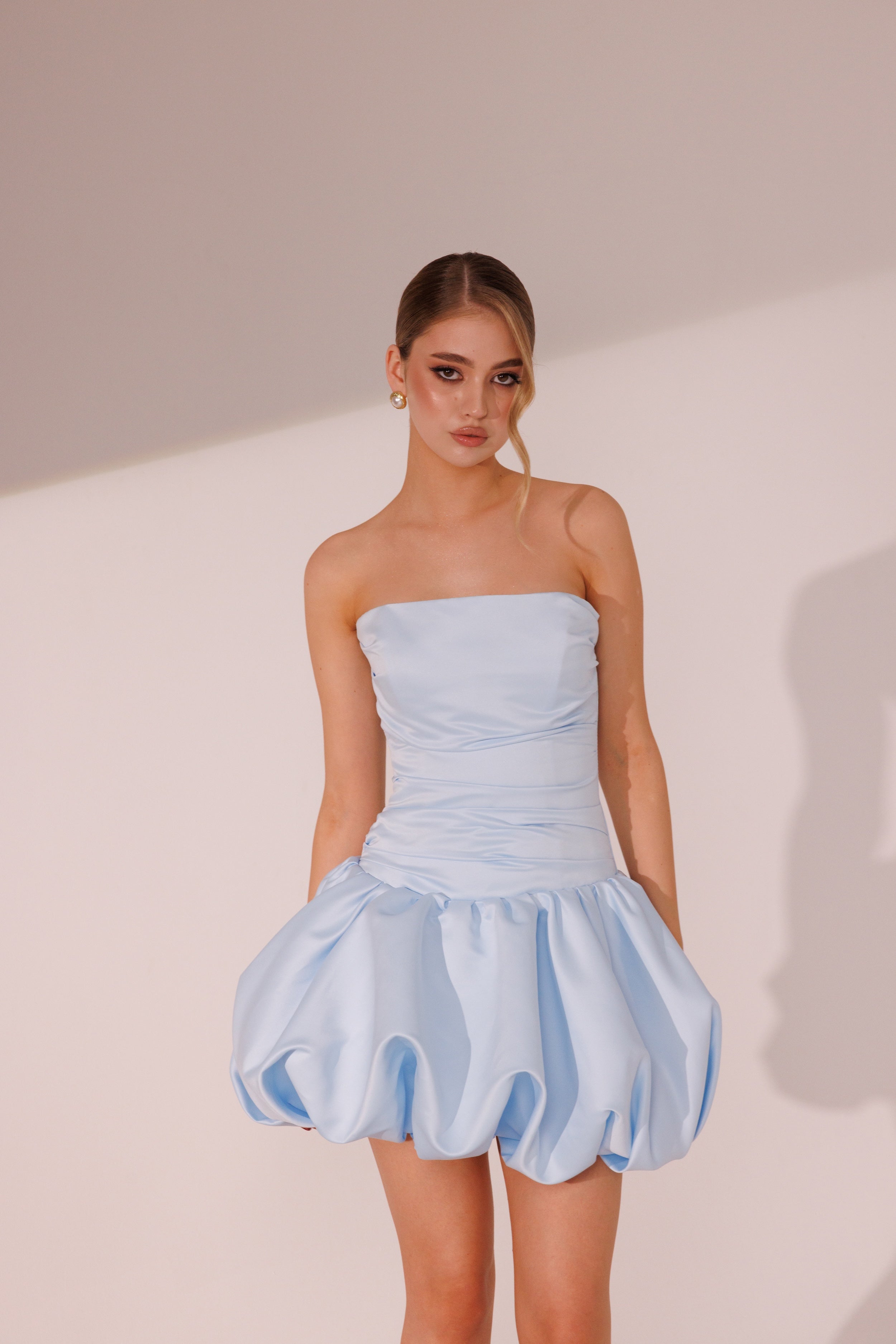 Flora Dress in blue color with strapless bodice and sculpted mini skirt by Lafatale Atelier