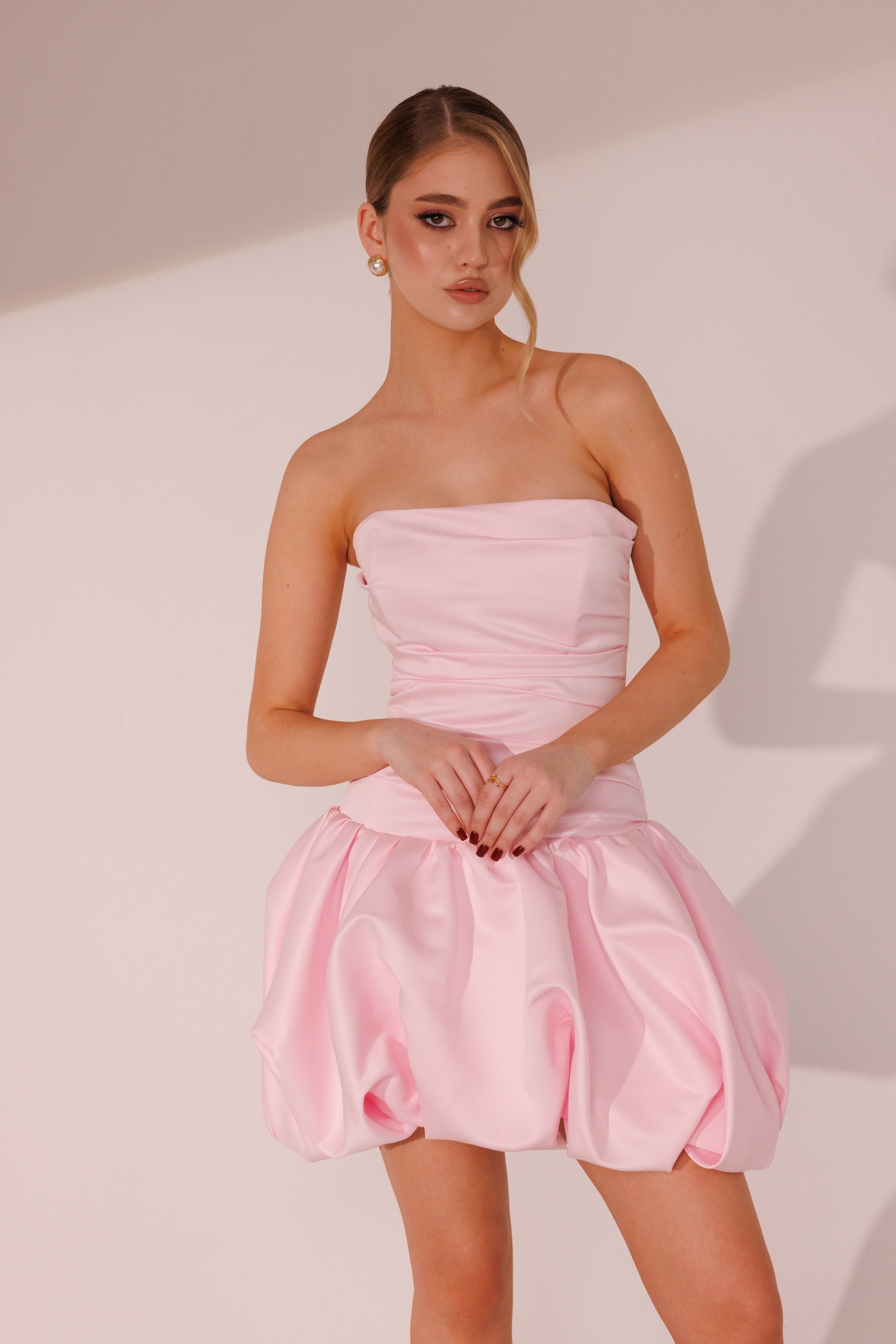 Flora Dress in pink color with strapless bodice and sculpted mini skirt by Lafatale Atelier