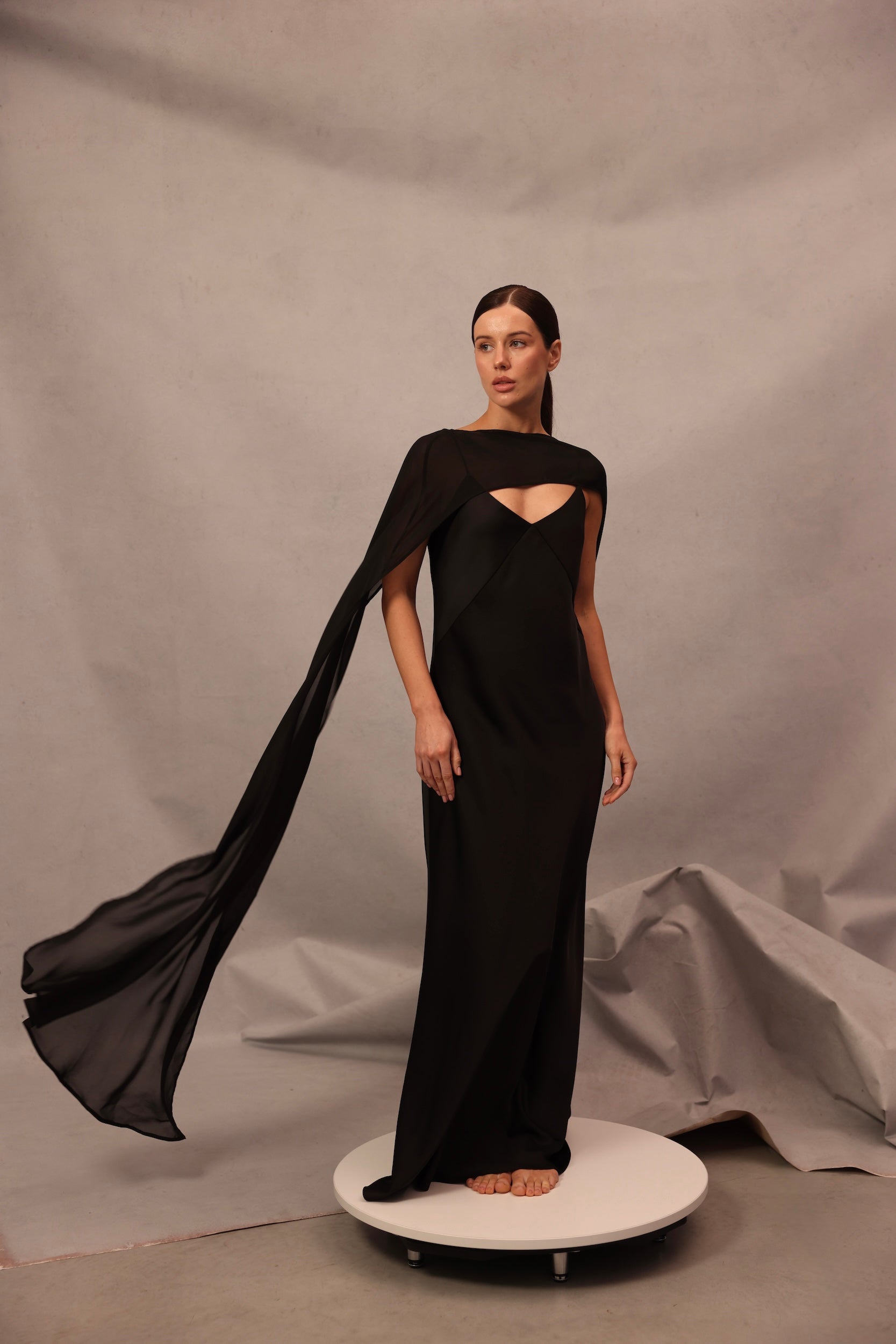 Luna Dress in black color with flowing cape sleeves and elegant maxi silhouette by Lafatale Atelier