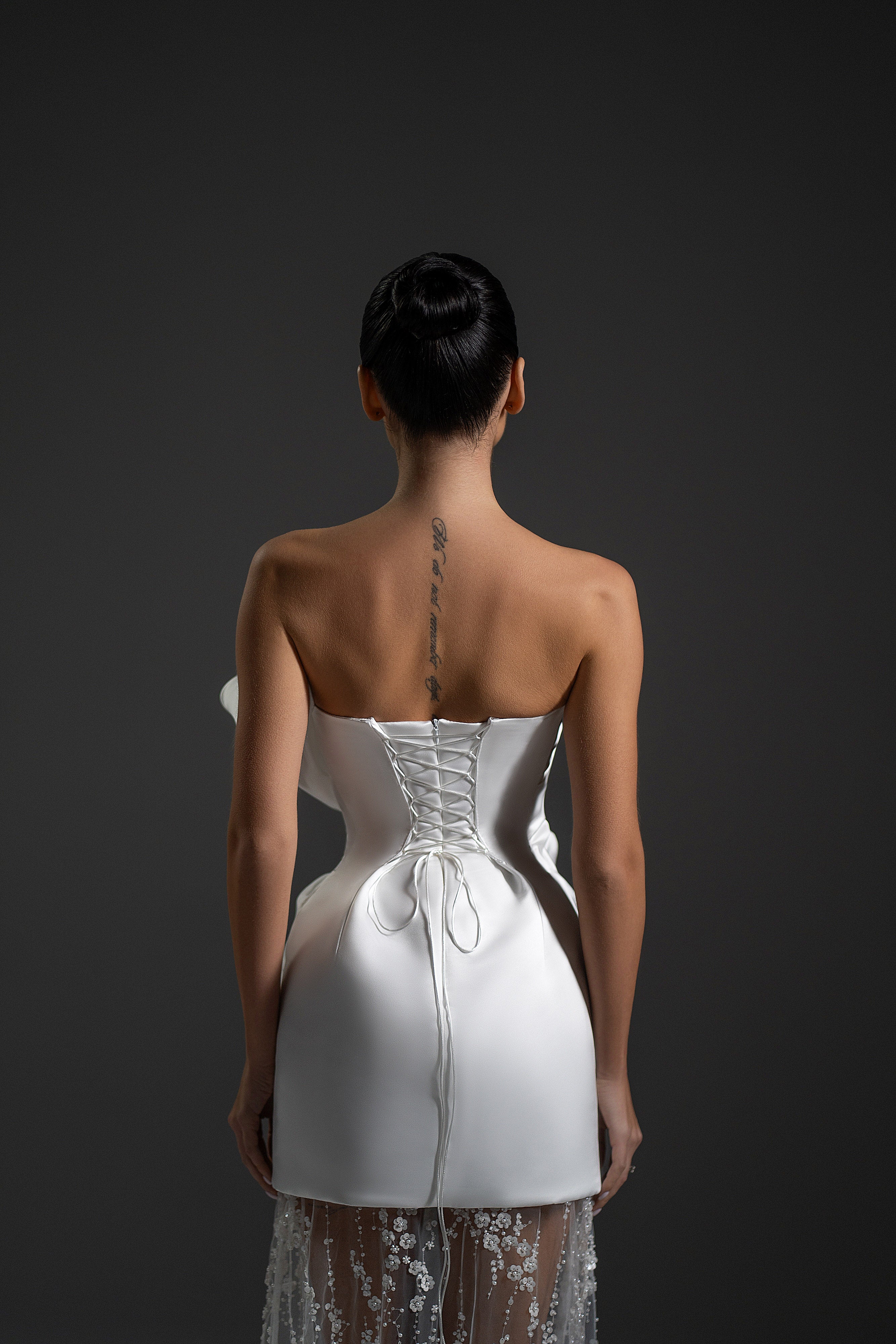 Back view of Serene Maxi Dress in white color with fitted satin bodice