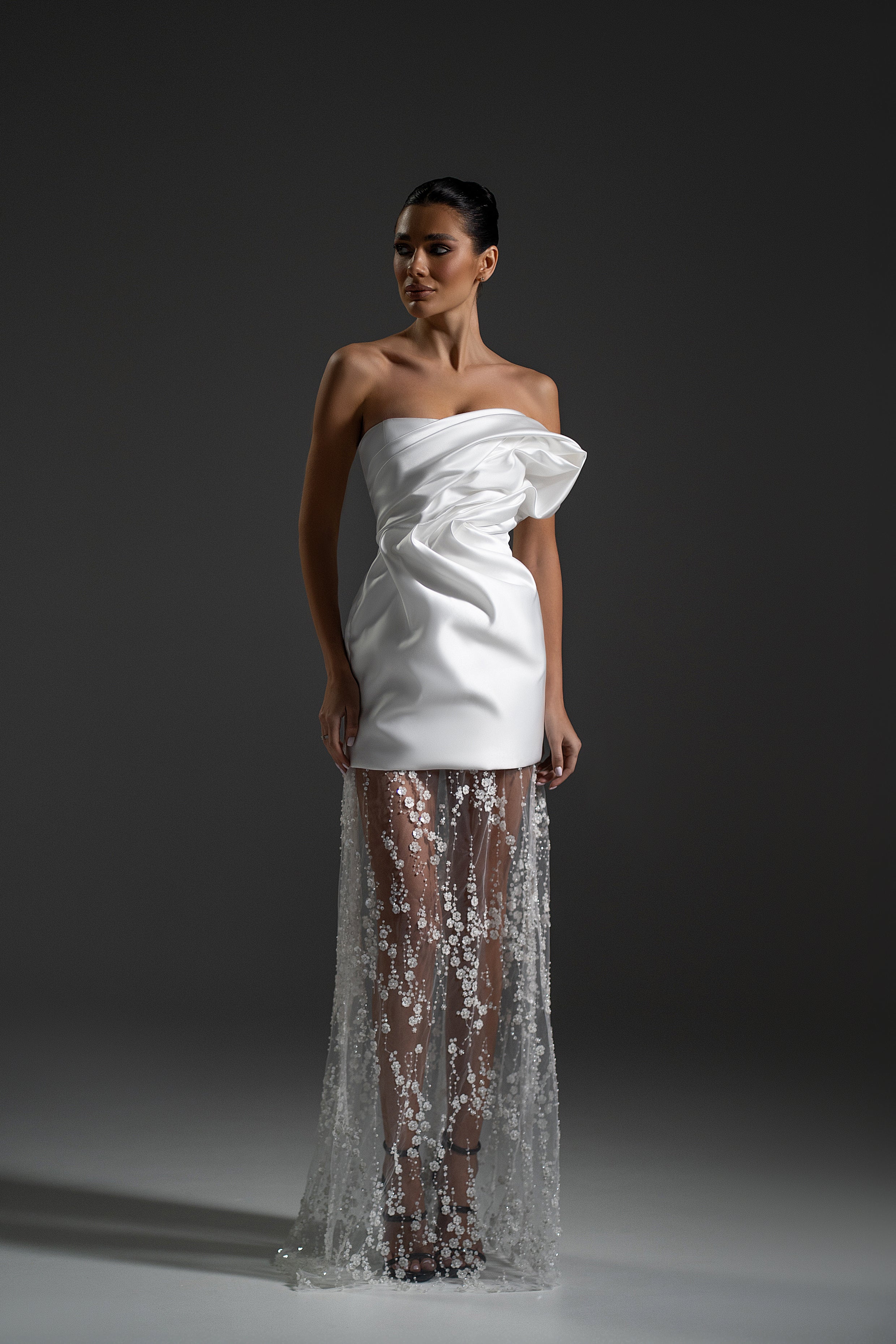Serene Maxi Dress in white color with satin draped bodice and sheer embellished skirt by Lafatale Atelier